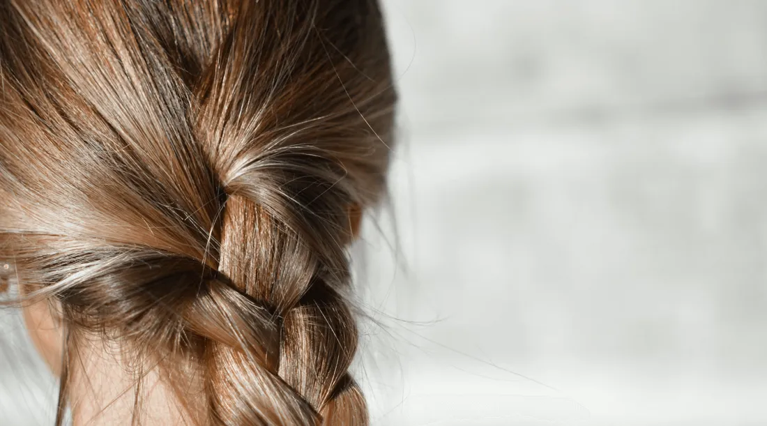 Close-up of brown hair in a loose braid