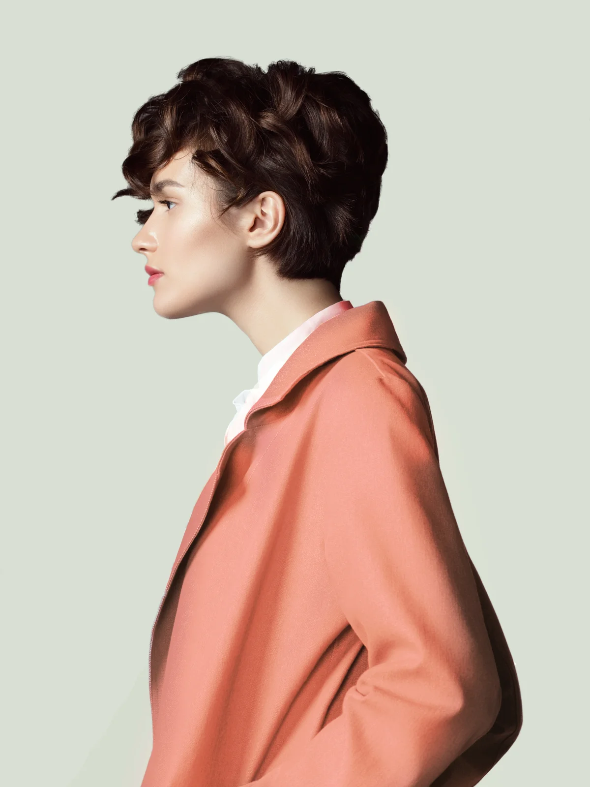 Woman with a short, textured dark haircut